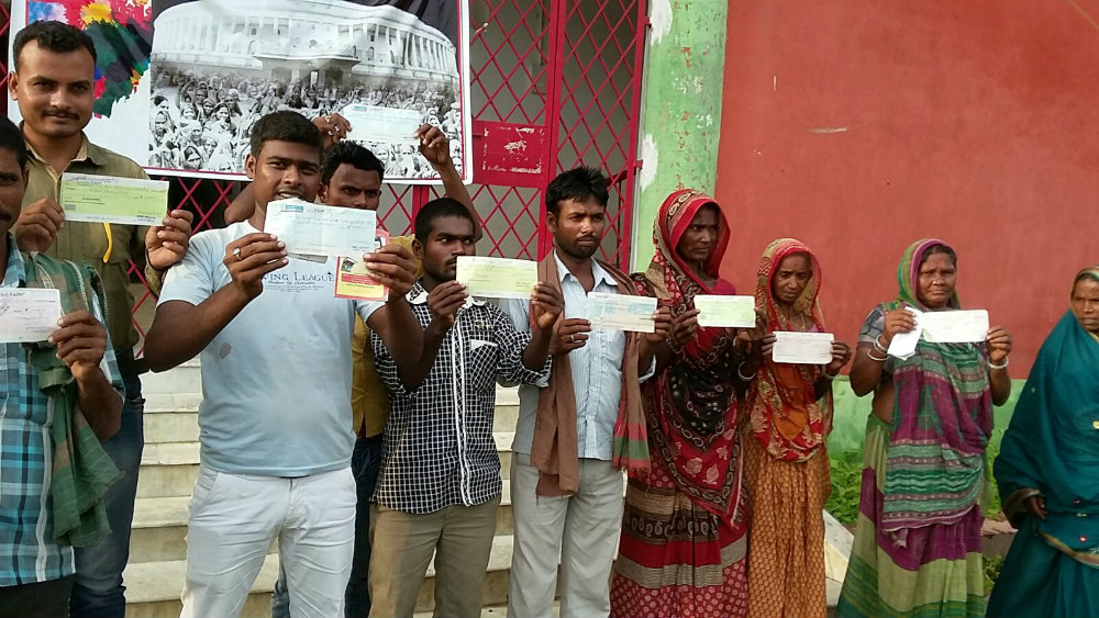 Victims showing uncashed government cheques .