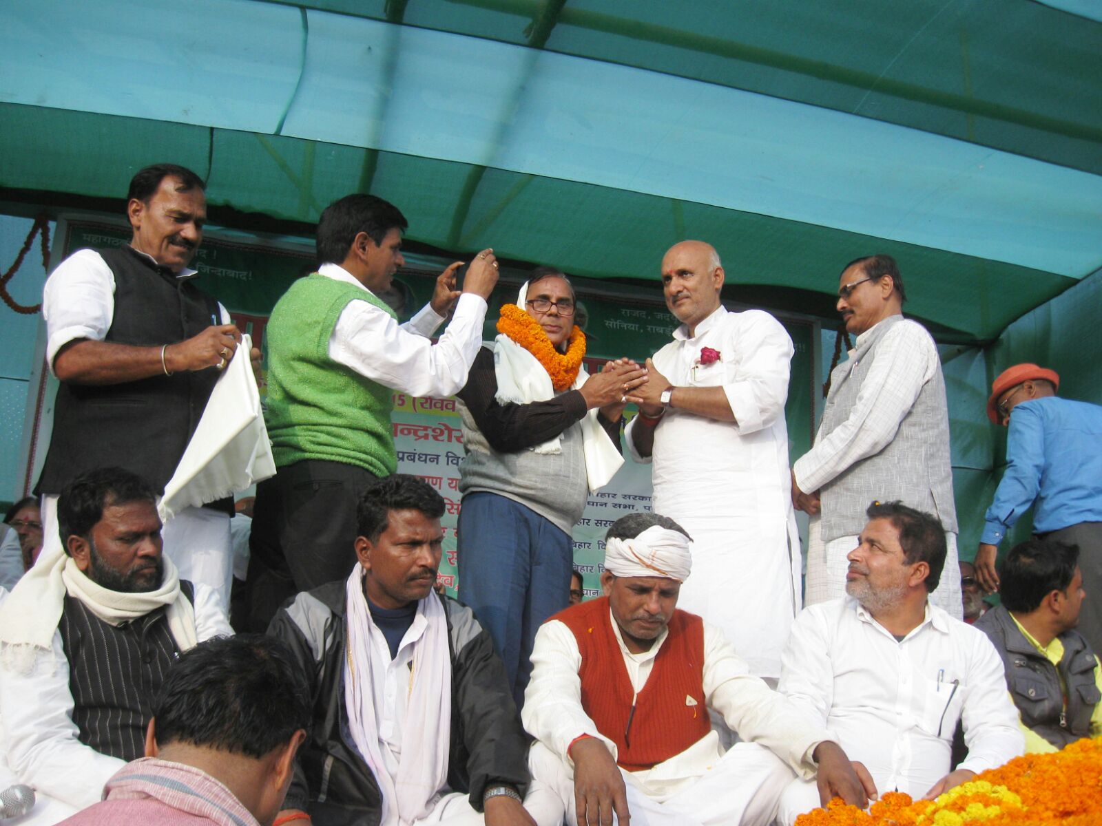 Samajsevi Sahityakaar Dr.Bhupendra Madhepuri being honoured by Minister Prof.Chandrashekhar .