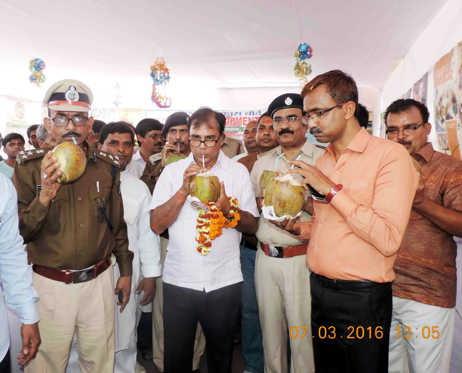 From L to R - DIG Chandrika Prasad, Dr. Madhepuri, SP Vikas Kumar, DM Md. Sohail, SDM Sanjay Kumar Nirala enjoying coconut water in Mela campus after inauguration of Coconut Stall.