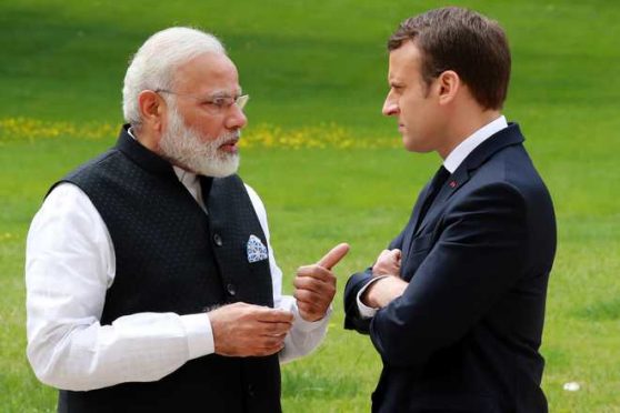 Prime Minister Narendra Modi and President of France Emmanuel Macron talking about Madhepura Rail Engine Factory.
