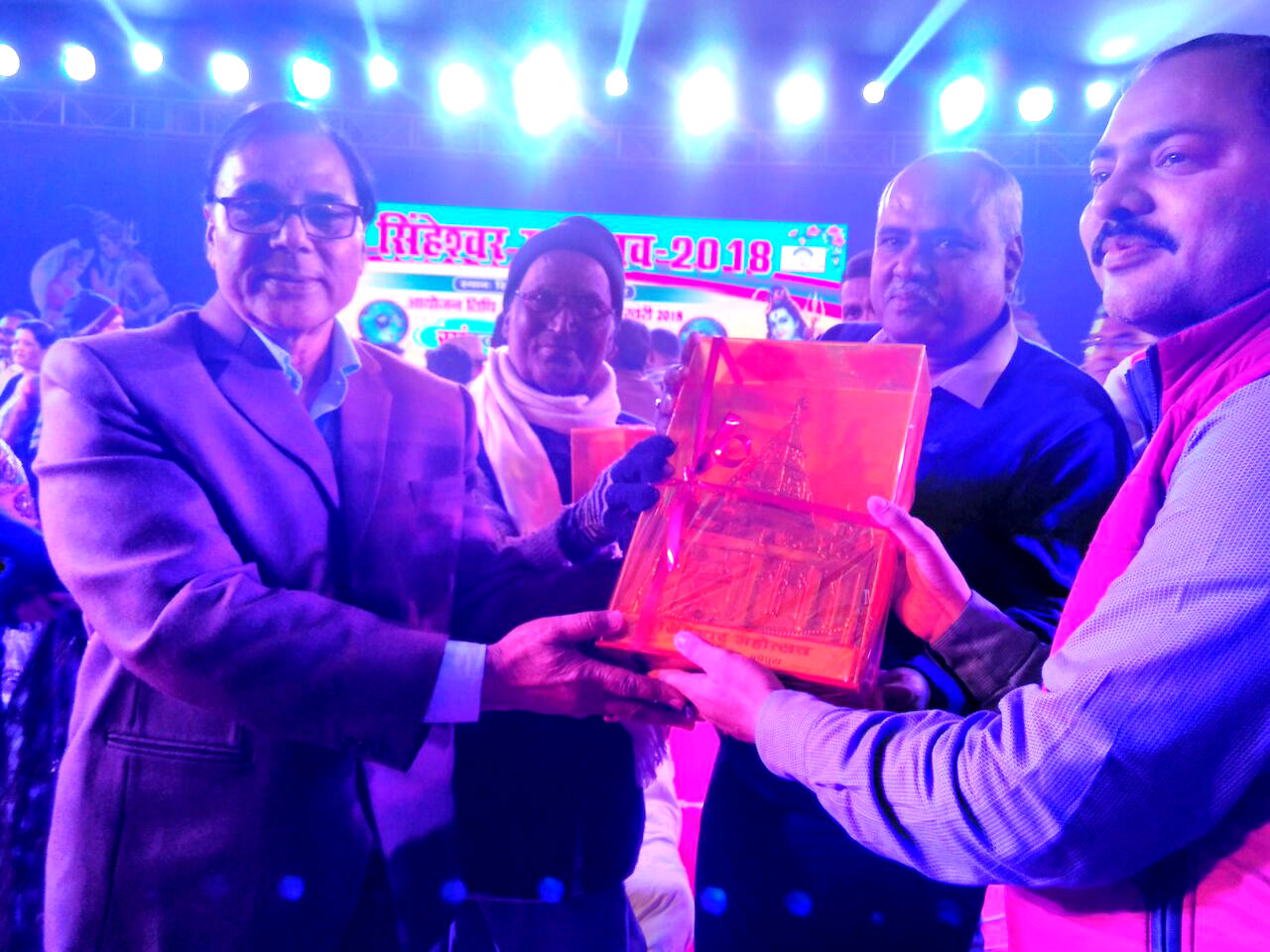 Samajsevi Dr.Bhupendra Madhepuri , President Awardee Prof.Y.N.Yadav and DDC Mukesh Kumar giving momento to NDC Rajneesh Roy for the best arrangements of Singheshwar Mahotsav 2018.