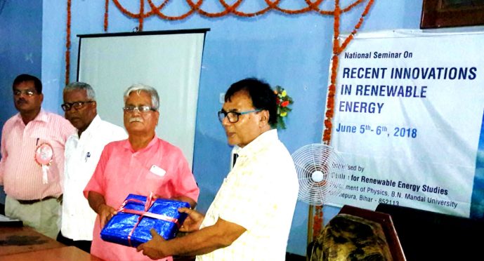 Physics Stalwart Dr.B.N.Yadav Madhepuri giving special gift to Former IIT Director Dr.Gopal Nand Tiwari at Ending Session of Renewable Energy National Seminar at BN Mandal University Auditorium, Madhepura.