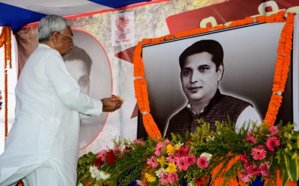 Chief Minister Nitish Kumar paying homage to BP Mandal at Murho , Madhepura on the occasion of 100th birth anniversary .