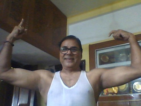 Dr.B.N.Yadav Madhepuri showing his muscles during corona pandemic lockdown at his residence Vrindavan.