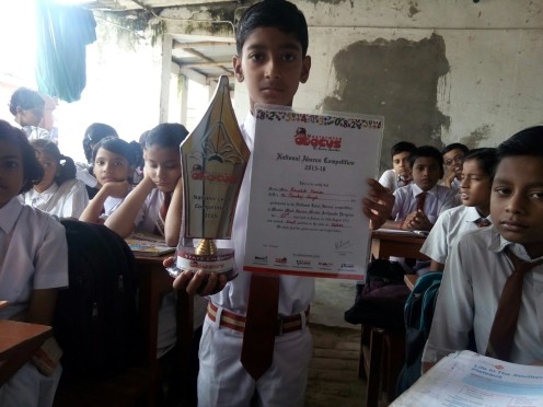Kaushik Kumar with his award and trophy at South Point Public School Madhepura.