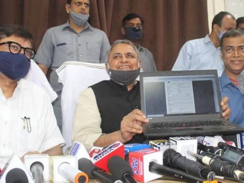 bihar education minister vijay kumar choudhary giving prize money to matric and inter toppers.